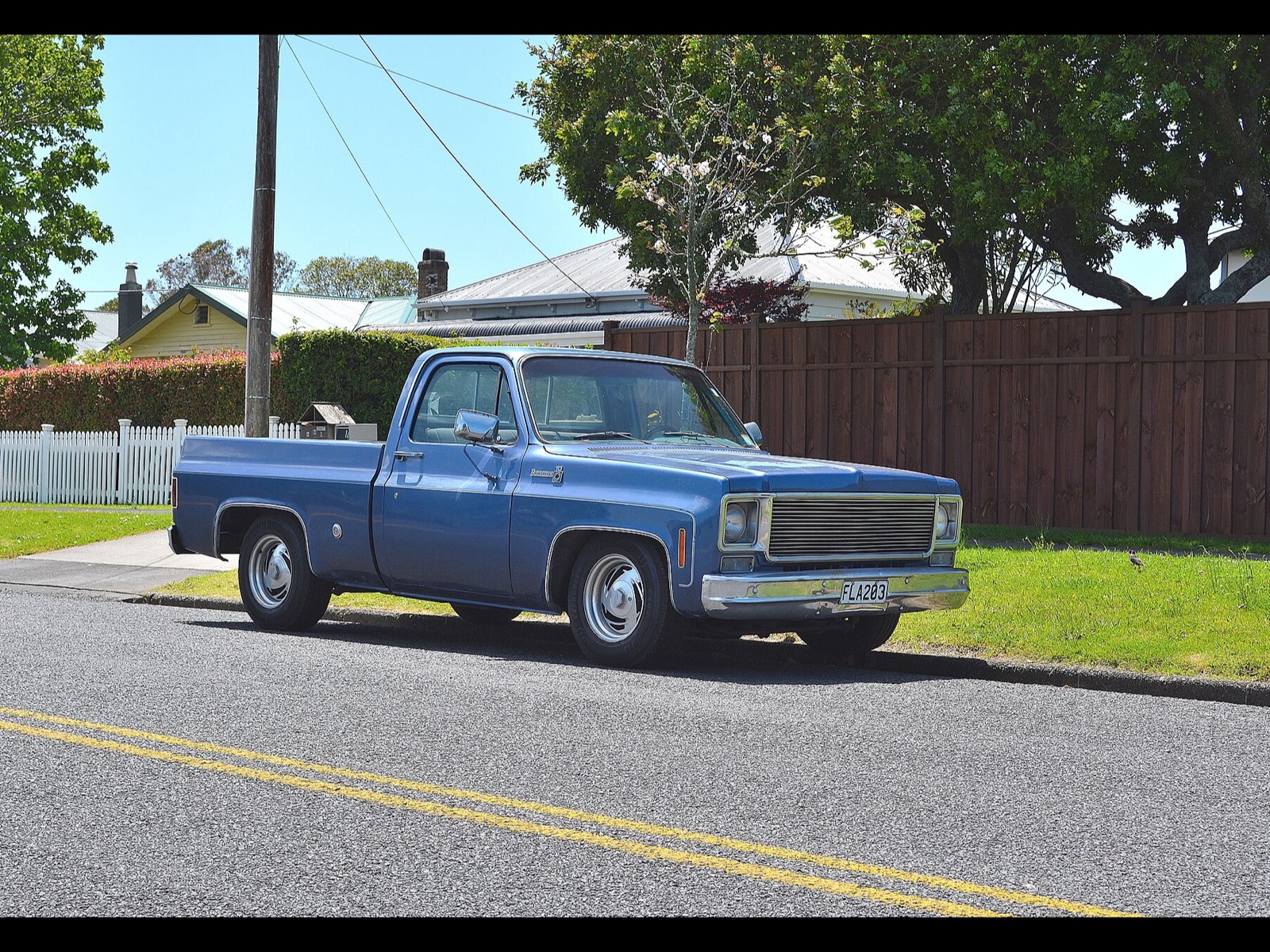A 1978 Chevrolet pickup parked on a residential street (stock photo)