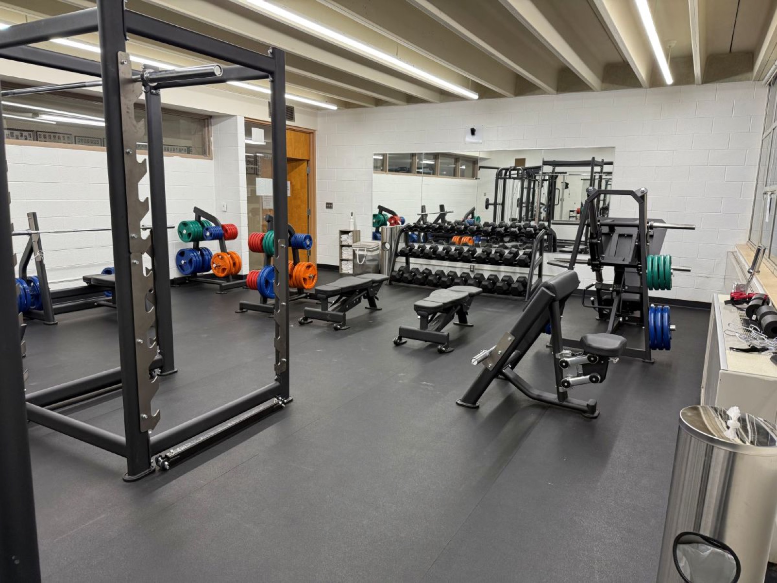 Squat rack, dumbbell rack and incline bench in the Wolverine Den fitness center